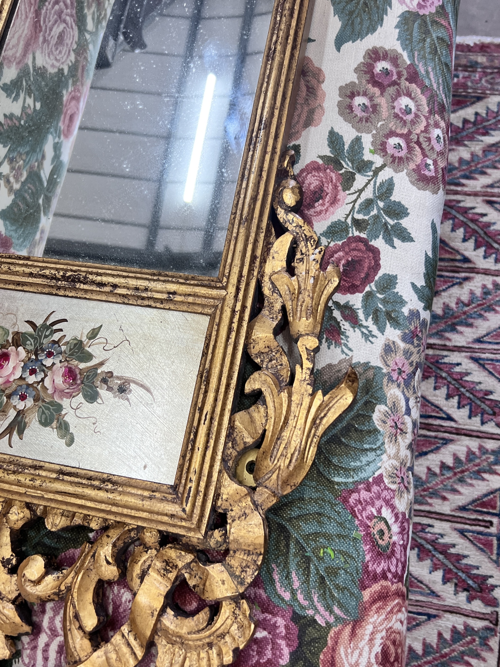 An 18th century style carved giltwood wall mirror, width 44cm, height 112cm